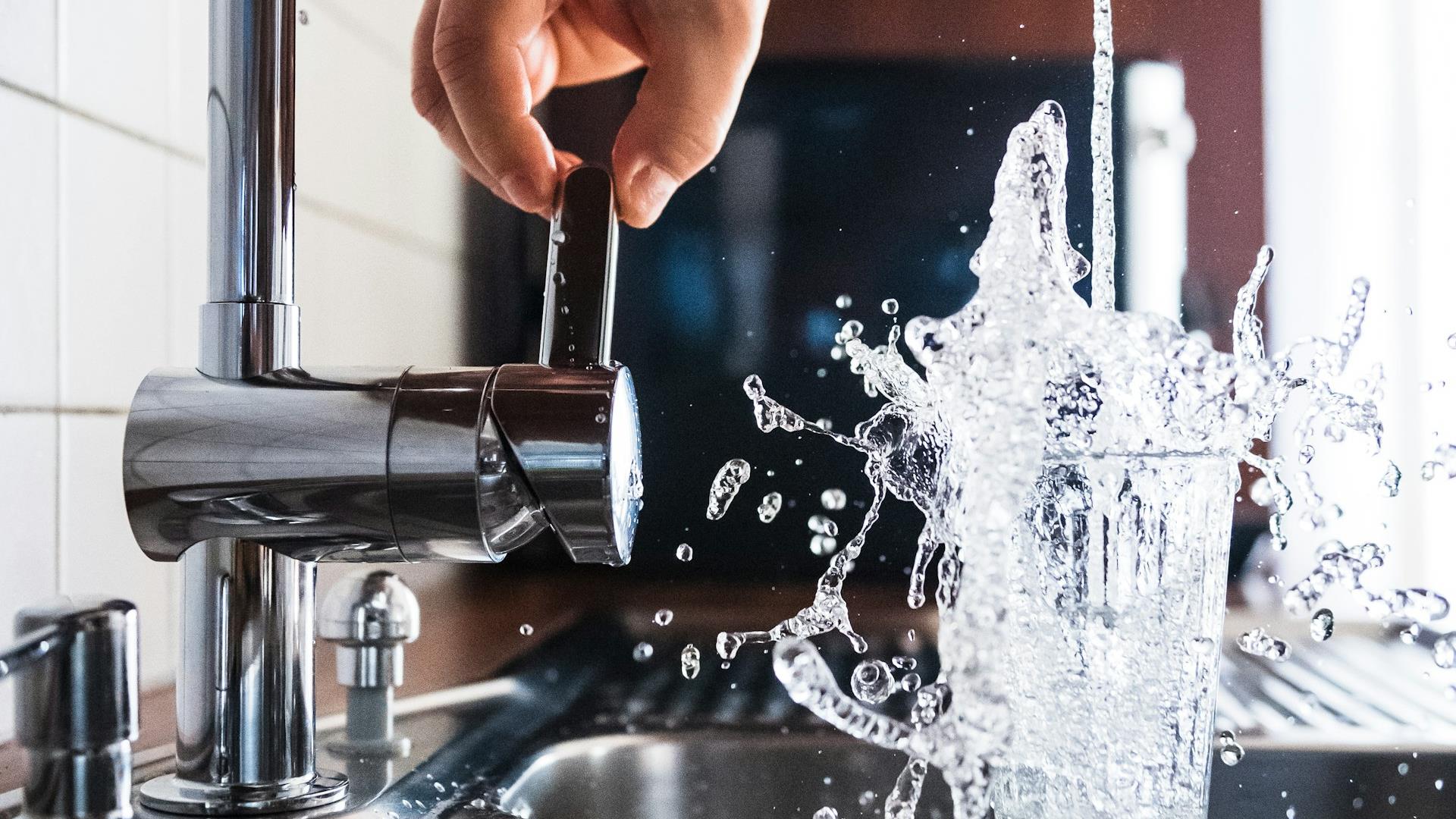Clean water pouring from a kitchen faucet